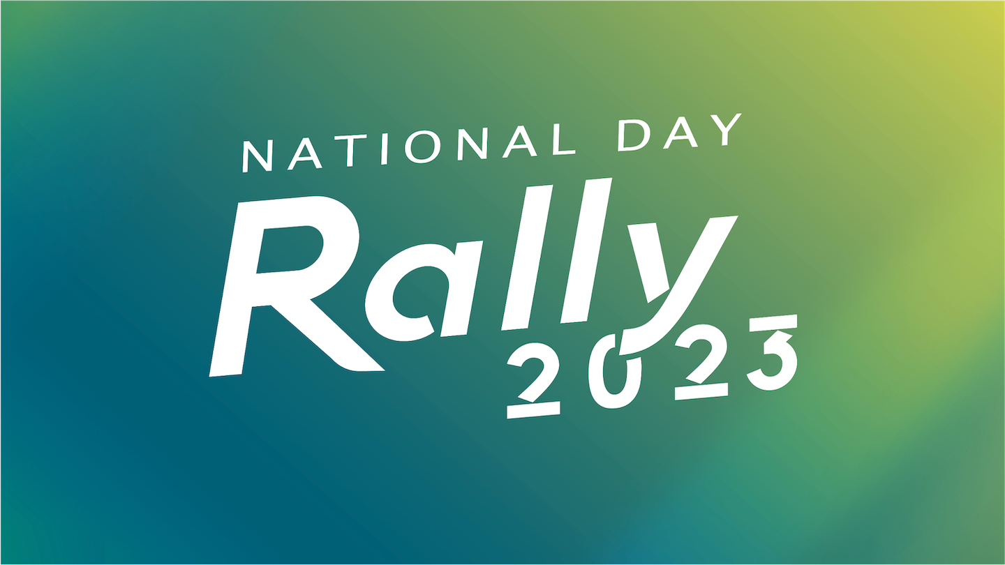 Text "National Day Rally 2023" in white on blurred green and blue gradient background.